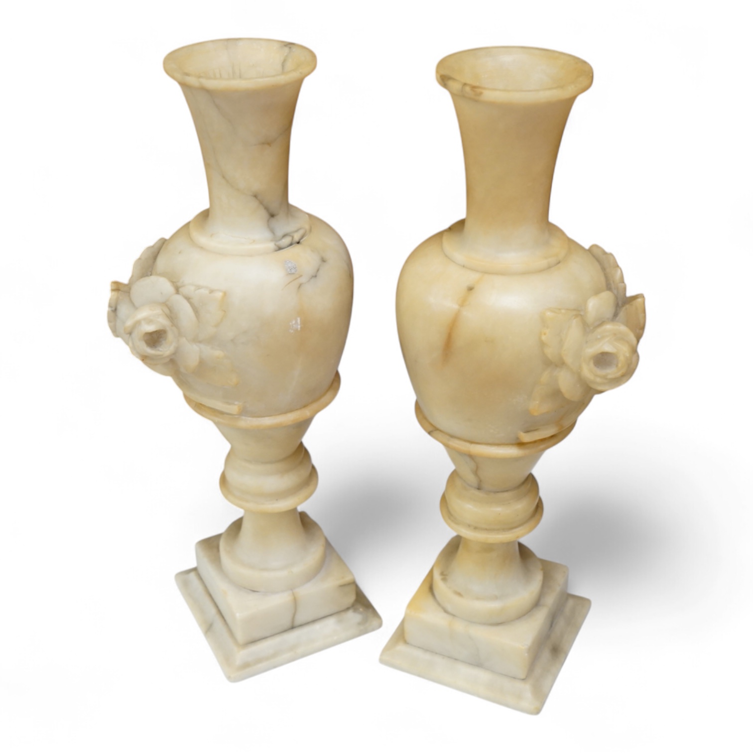 A pair of carved alabaster vases, 32cm high.